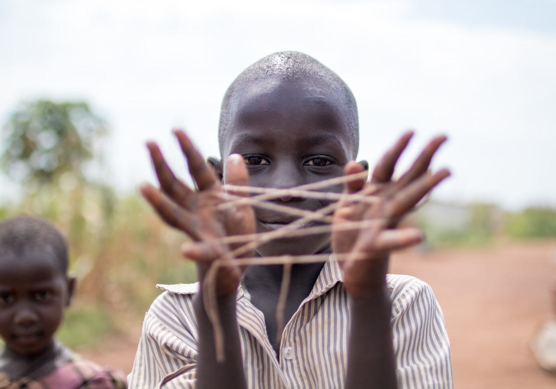 boy with hand string